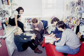Photograph of students gathered together and chatting in the residence dorm