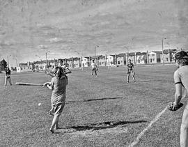 Photograph of Staff Members Playing Baseball on the Football Field