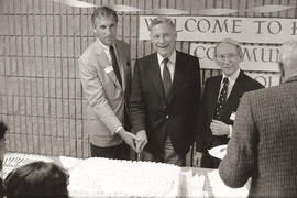 Photograph Dr. Robert A. Gordon and Etobicoke Mayor Bruce Sinclair cutting cake at the official o...