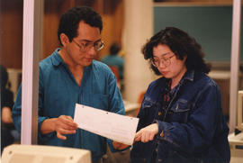Photograph of two students working at a computer