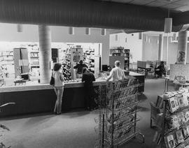 Photograph of students at the Lakeshore Library circulation desk