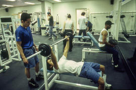 A photograph of students using various fitness equipment