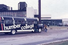 Humber collge bus in front of power plant : [photograph]