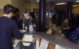 Photograph of students at the service desk in residence