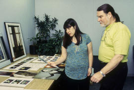 Photograph of faculty members reviewing students work