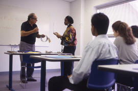 Photograph of an Instructor Lecturing in Classroom