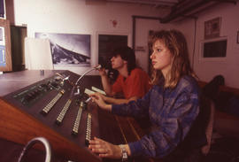 Photograph of Film and Television students operating a video control console
