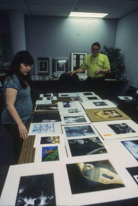 Photograph of faculty members reviewing students work