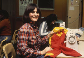 Photograph of Someone Making Children's Clothes in the Sewing Lab