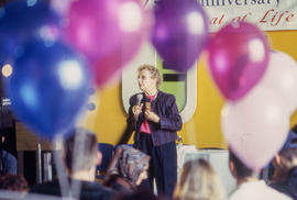 Photograph of Sue Johanson standing in-front of an audience