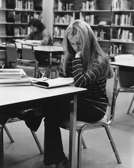 Photograph of a Student Studying in the Library