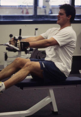 Photograph of a student working out on equipment in the Athletic Centre.