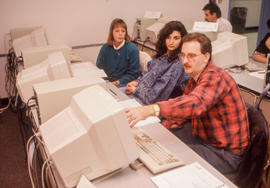 Photograph of adult learners working together at computers