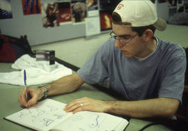 A photograph of an Industrial Design student making sketches