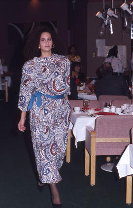 Photograph of a fashion model in a dining room