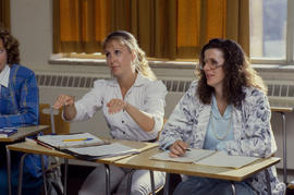 Photograph of students practicing sign language in class
