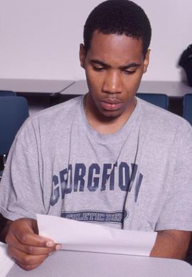 Photograph of a student reviewing their notes