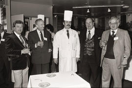 Photograph of a chef, Igor Sukor, and guests in the Humber room