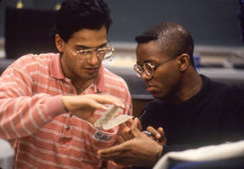 Photograph of students looking at circuit cards together