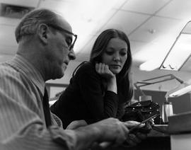 Photograph of a Student Watching Harold Stacey Filing Down a Ring