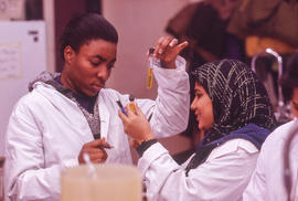 Photograph of two students in the chemistry lab