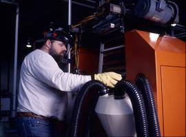 Photograph of a student operating an equipment