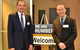 Chris Whitaker and Joe Andrews in front of a Humber sign