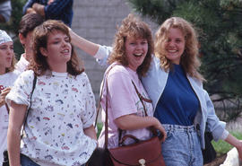 Photograph of three friends smiling for the camera