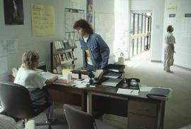 Photograph of persons at a service desk