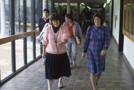 Photograph of staff members Kathy Rolands, Stephany Fox walking the hallway
