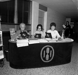 Photograph of Humber staff working at an information table during open house