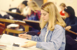 Photograph of a class of young women in an Architecture program drafting lab