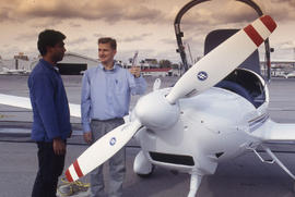 A photograph of a Flight Aviation faculty and their student