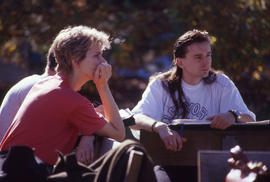 Photograph of students sitting at benches working on an assignment