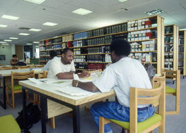 Photograph of students studying in the library