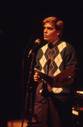 Photograph of a student at the microphone