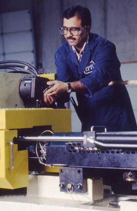 Photograph of a student working with a machine
