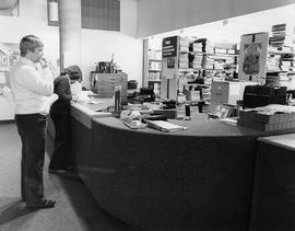 Photograph of students at the Lakeshore library circulation desk