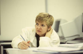 Photograph of student listening to a lecture