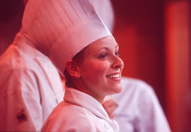 Photograph of a Culinary student with other students in the background