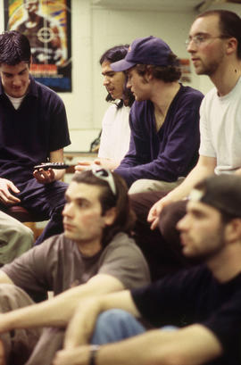 A photograph of Industrial Design students examining a design model