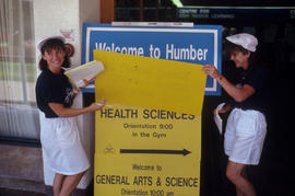 Photograph of a Welcome Sign at the D Building Main Entrance