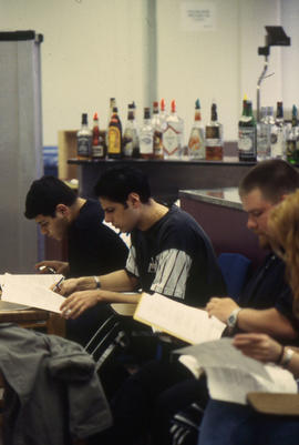 A photograph of students in the Bartending lab