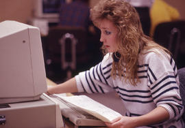 Photograph of a student seated infront of a computer