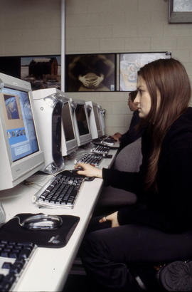 Photograph of two students in the journalism lab