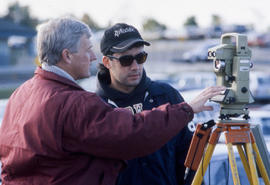 Photograph of Frank Mee instructing a Civil Engineering student