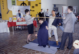 Photograph of a limbo dance contest in E Building