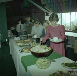 Photograph of guests at a buffet table