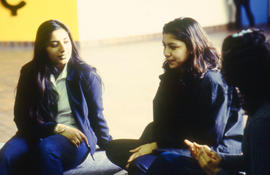 Photograph of students sitting and chatting