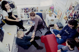 Photograph of students sitting in a residence dorm